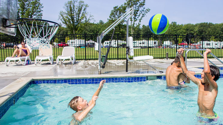 boys playing water basketball