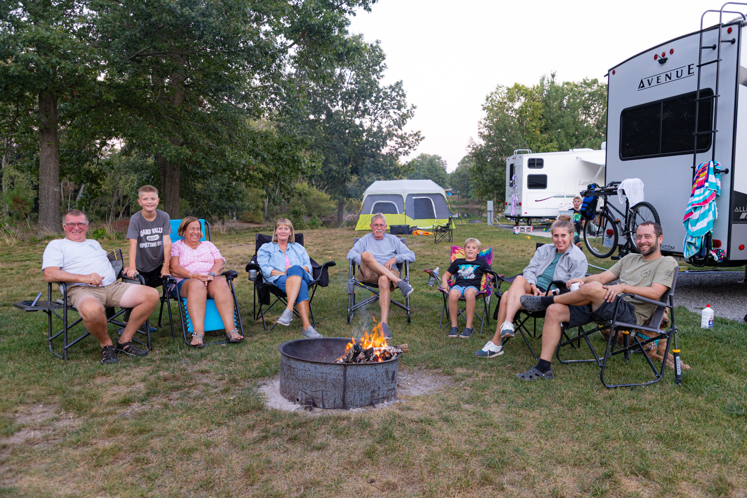 Family around the campfire at Dunes Harbor